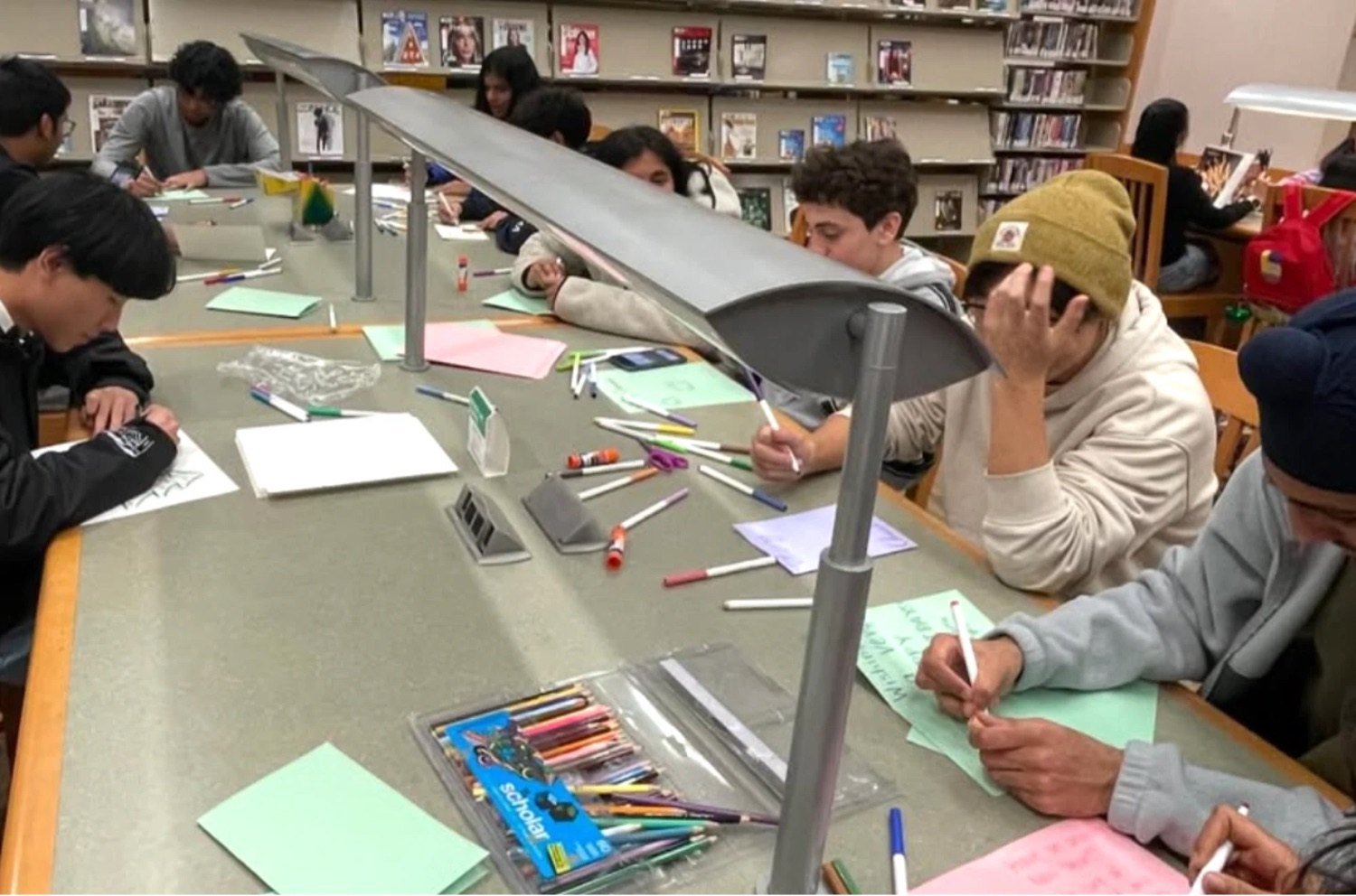 Students writing together at an NHA session