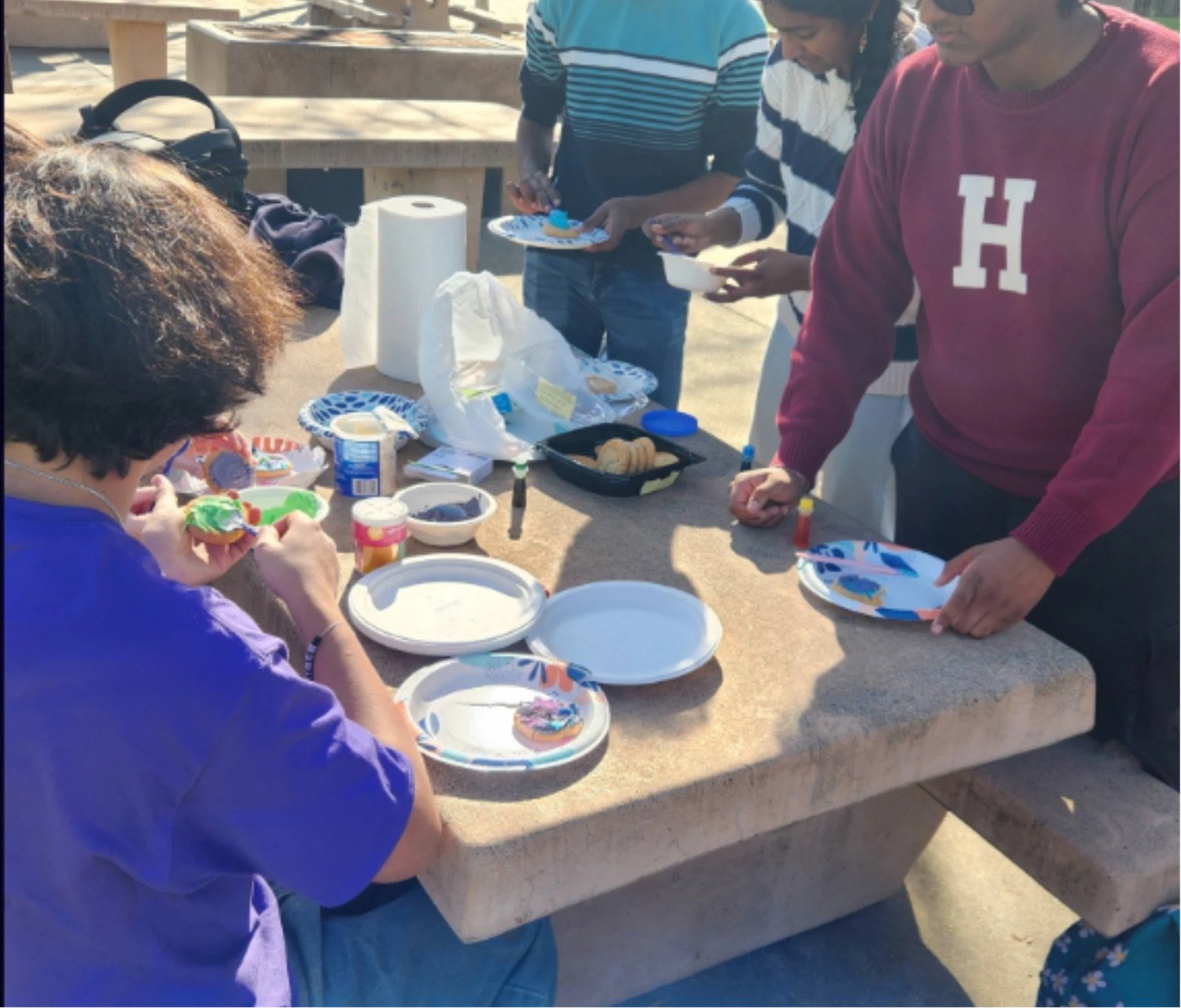 Students decorating together at an outdoor NHA event